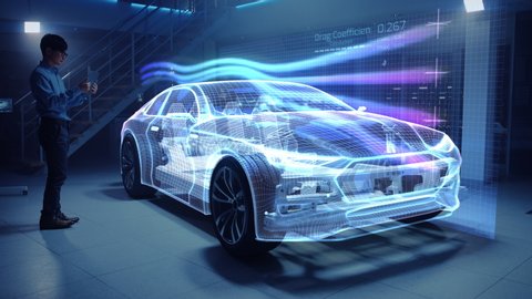 Automotive Engineer Working on Electric Car Chassis Platform, Using Tablet Computer with Augmented Reality 3D Software. Vehicle Virtual Mesh Model is Tested in Digital Wind Tunnel.