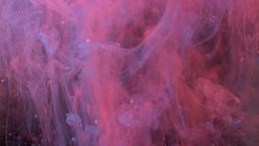Lockdown shot Of colorful acrylic paint dissolving in liquid - Powered by Shutterstock - Get 15% off with code: PIKWIZARD15