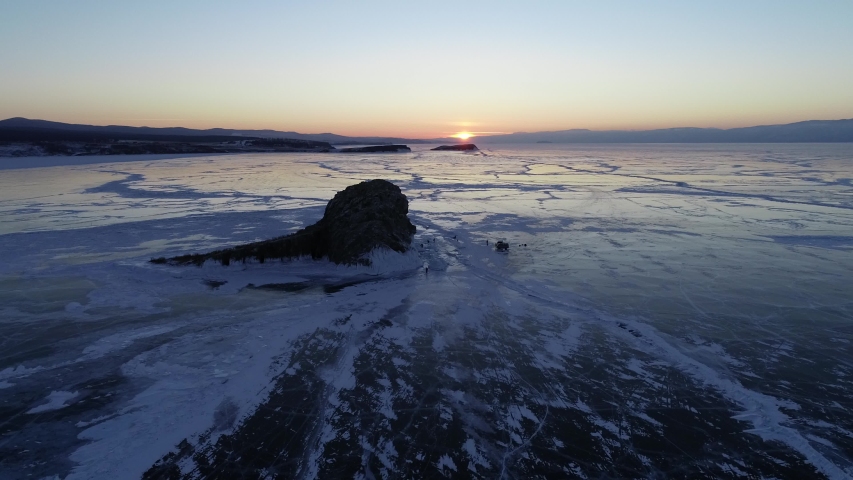 Sunset over frozen Baikal Lake.