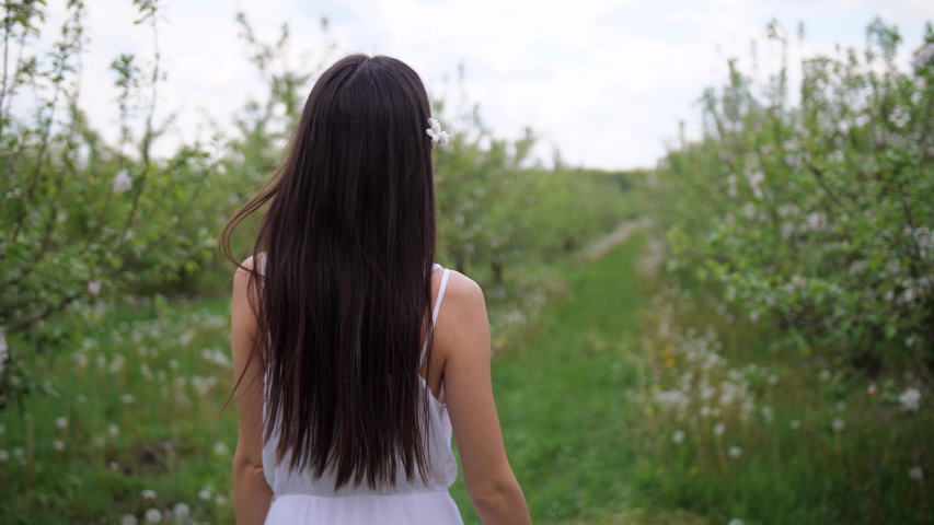 back view long-haired asian woman wandering Stock Footage Video (100% ...