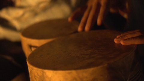 Percussionist playing bata drums in Africa