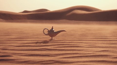 Aladdin magic lamp on a desert. Strong wind in the desert.