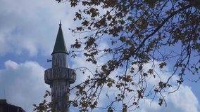 Minaret of Mosque Behind Tress Old Minaret of Middle East Underf Blue Sky Full HD Cinematic Islamic Video for Muslim Mosques