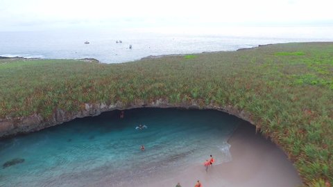Aerial pull back shot of the hidden beach of the Isla Redonda, Marietas Islands, Nayarit, Mexico