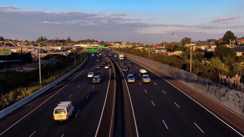 Time lapse of motorway traffic during golden hour in Auckland New Zealand