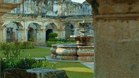 Old courtyard with a fountain in Antigua, Guatemala