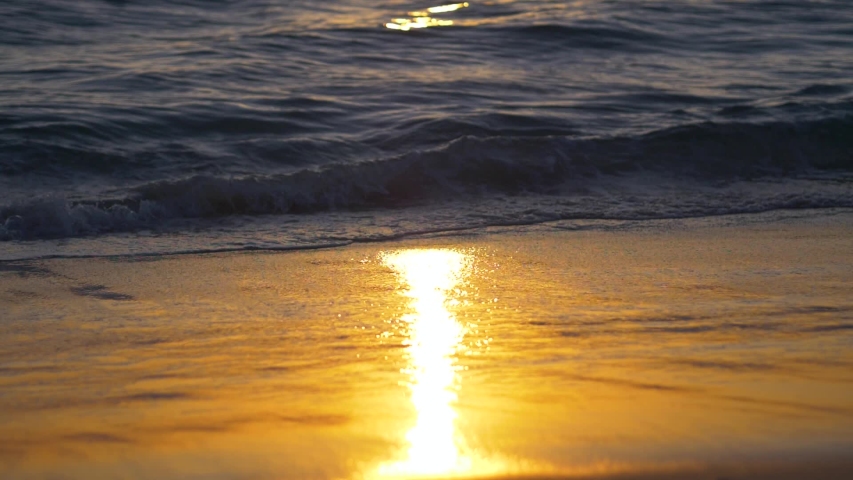 Sunrise over Australian beach and waves (slow motion)