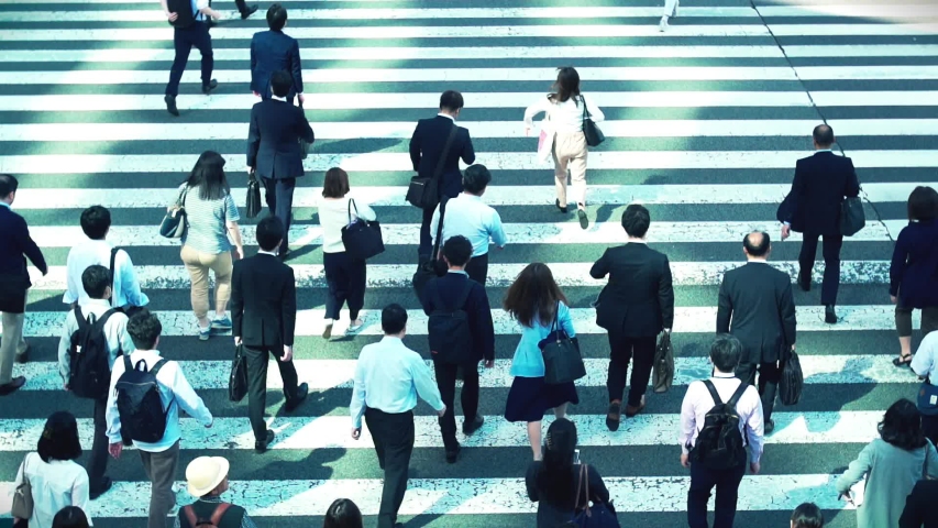 Japanese businessmen go to work in the morning in Tokyo Japan Royalty-Free Stock Footage #1030032413