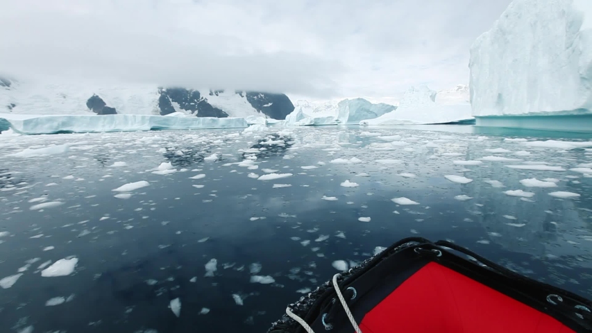 cruise in Antarctica, small inflatable boat travel through the ice in Iceberg Graveyard, beautiful nature landscape