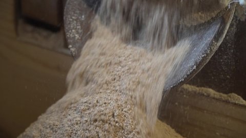 Close up of grain processed into flour at old fashioned mill