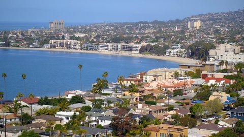 Aerial Drone footage overlooking Mission Beach and Mission Bay on a beautiful sunny day in San Diego, California. 