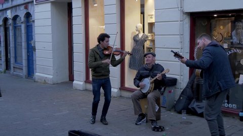 Street musicians in the city of Galway Ireland - GALWAY, IRELAND - MAY 11, 2019
