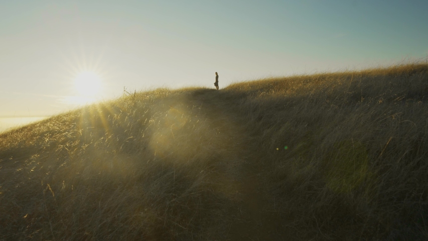 Top of Mount Tamalpais in Marin County, California. Walking with a gimbal looking up at a person during golden hour.