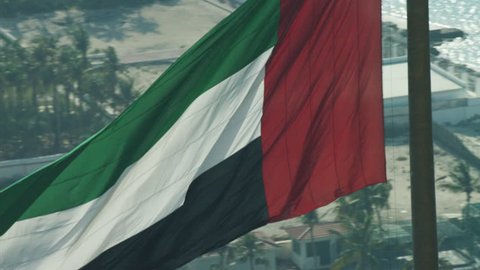 Aerial National Flag flying Pole Urban District Dubai UAE