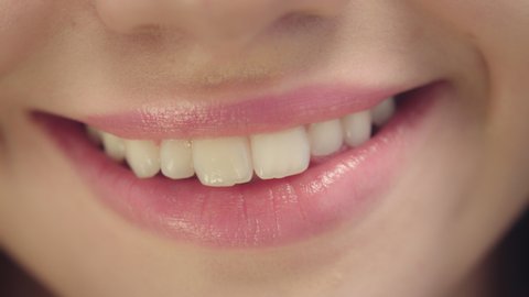Smiling female mouth with ideal white teeth. Close up of smiling woman face with perfect smile. White teeth smile concept