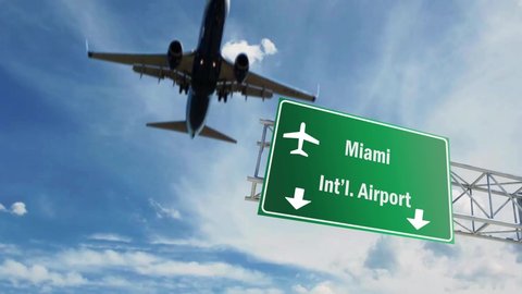 Airport sign. Miami airplane passing overhead.