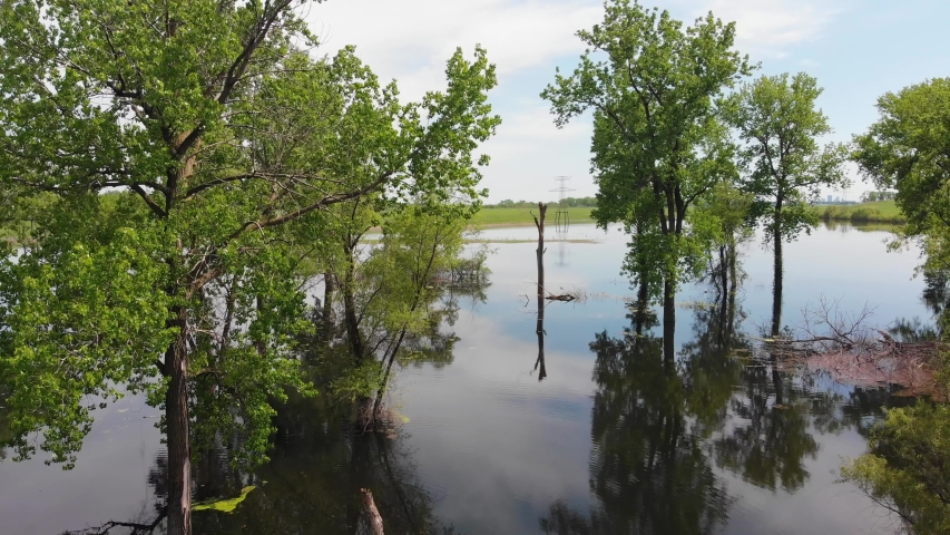 Drone Aerial of Flooded Fields and Forest by Mississippi River on Sunny Spring Day
