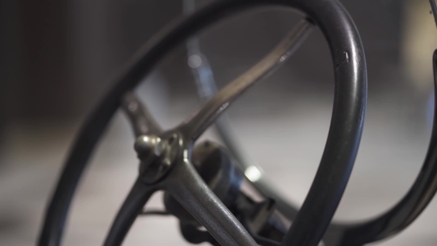 Close-up shot of a steering wheel of a vintage car of the years / decade of 1950., a Video by BlackBoxGuild