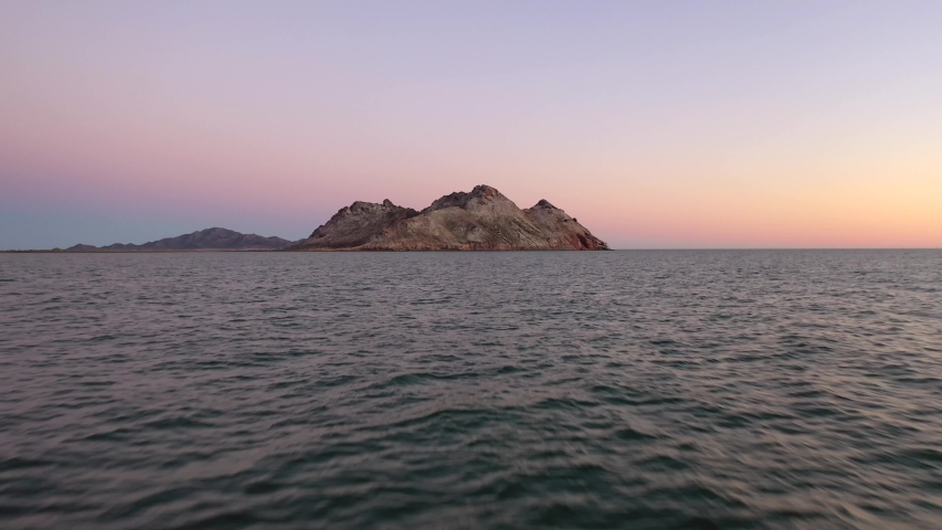 a quick trip to an island in low flight at sunset