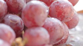 Close up view of fresh red grapes. Selective focus. Tracking shot.