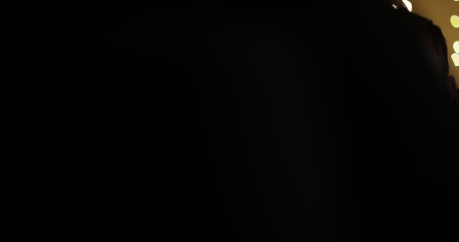 4k, A young attractive man engrossed in playing games on a touchscreen tablet. Slow motion