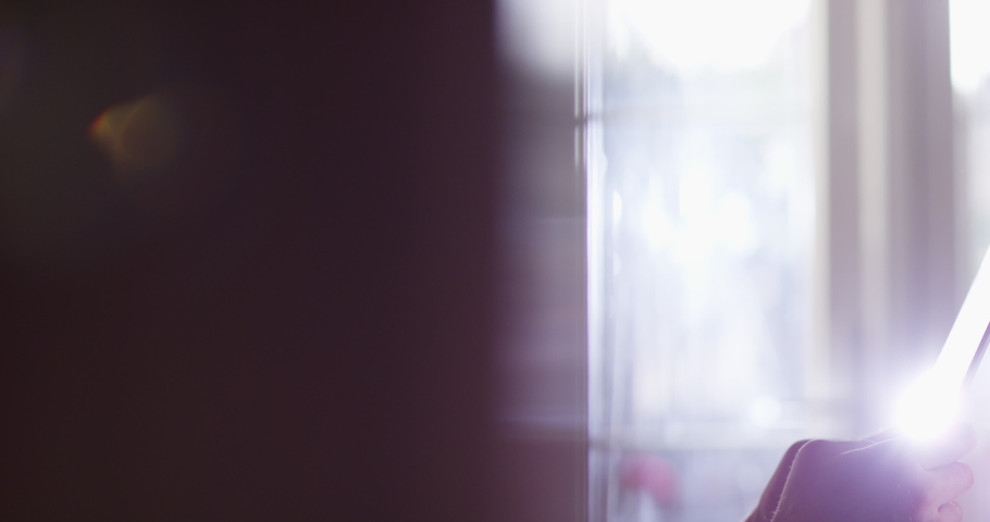 4K Close up of businessman concentrating while working on computer tablet. Slow motion.