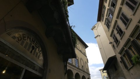 Italy, Florence - April, 2016: The top floors of buildings on a street