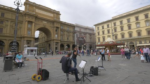 Italy, Florence - April, 2016: Street musicians performing in Piazza della Repubblica, Florence