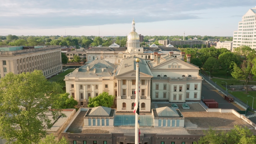 Drone footage of capitol building in Trenton on a sunny afternoon with slow uplifting camera movement. Trenton is the capital city of the U.S. state of New Jersey and the county seat of Mercer County