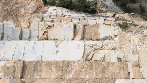 A quarry of Carrara white marble.  The precious white Carrara marble has been extracted from the Alpi Apuane quarries since Roman times.