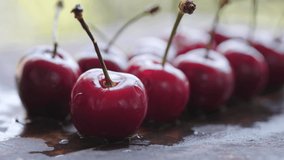 Close up footage of fresh cherry fruits. Selective focus. Tracking shot.