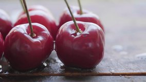 Close up footage of fresh cherry fruits. Selective focus. Panning to the left.
