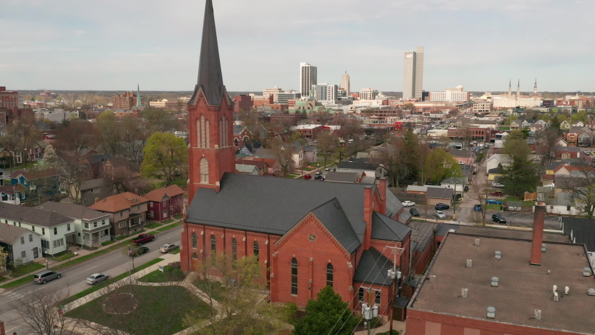 Aerial Elevating up over Long Flat Urban City SKyline in Fort Wayne Indiana