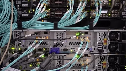 MOSCOW, RUSSIA - May 20, 2019 : Optical server. Commutator. flashing lights. Optical fiber. Severs computer in a rack at the large data center. Editorial