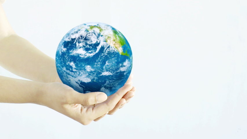 Hands holding the Planet. Young adult hands holding the globe on white background. Royalty-Free Stock Footage #1030187912