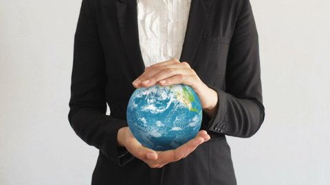 Businesswoman Holding the Planet in Hands.