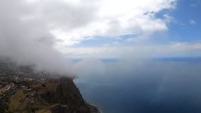 Madeira. Aerial drone bird's-eye view video of sea covered with clouds and fog