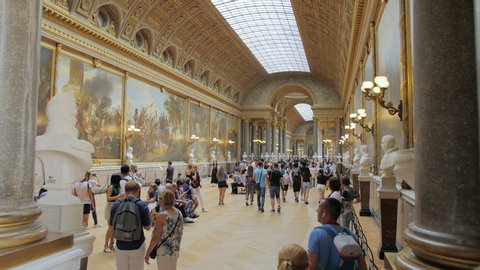 Versailles, PARIS, FRANCE- August 2018: A lot of tourists take pictures and see the sights in the main hall of the royal palace. Luxurious interior of the royal palace. a lot of busts of sculptures