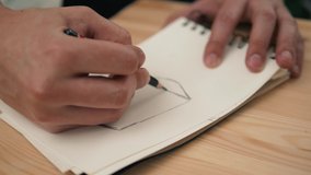 Man close up designer draw flower pencil, macro hand craftsman make picture male