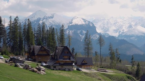 Slow Pan, showing houses in Zakopane mountains in Poland, with beautiful mountain scenery.