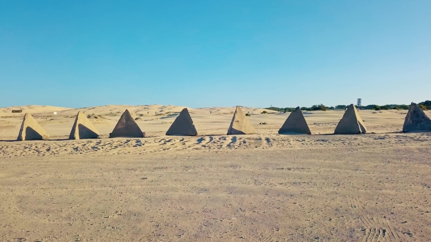 Drone Aerial of Concrete Pyramids Tank Traps From WWII at Sand Field in Stockton Worimi Aboriginal Conservation Park Australia 4k