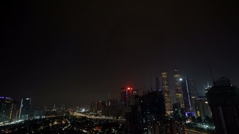 Kuala Lumpur, Malaysia - May 11, 2019: 4k establishing cinematic shot of night scene at Kuala Lumpur city skyline. 