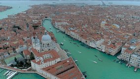 Aerial drone video of iconic and unique Santa Maria Della Salute Cathedral in Grand Canal, Venice, Italy