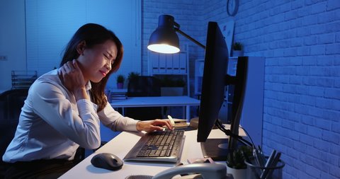 asian woman overtime work along and feel tired in the office
