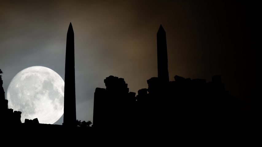 Luxor by Night with Full Moon: Ruins of Ancient Egyptian Temple Complex with Obelisks in Silhouette, Egypt, Africa