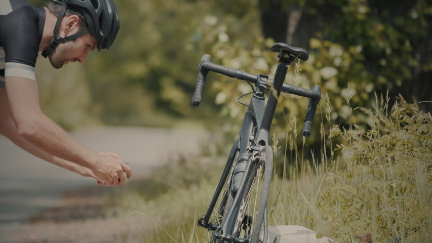 Cyclist Making Photo His Bike.Bicyclist Using Smartphone.Cyclist Using Phone.Bicyclist Taking Photo.Cyclist Takes Pictures Of His Bike.Cyclist Taking Photo Of His Bicycle.Athlete Photograph His Bike.