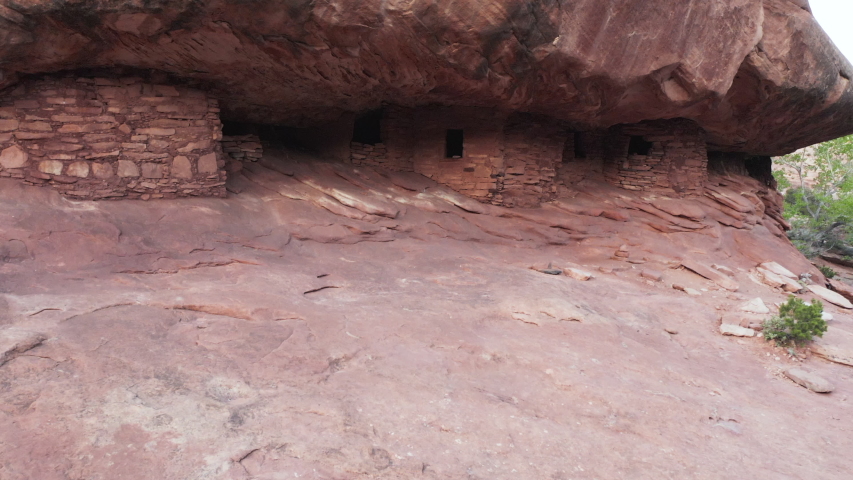 Rising aerial shot demonstrating the secluded location of Native American ruins in southern Utah