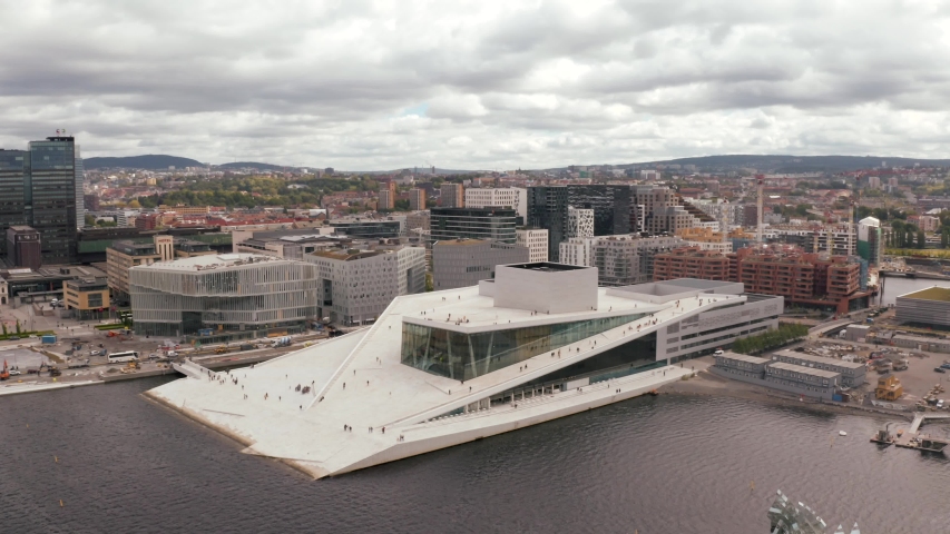 Aerial view on the National Oslo Opera House and Oslo downtown against cloudy sky