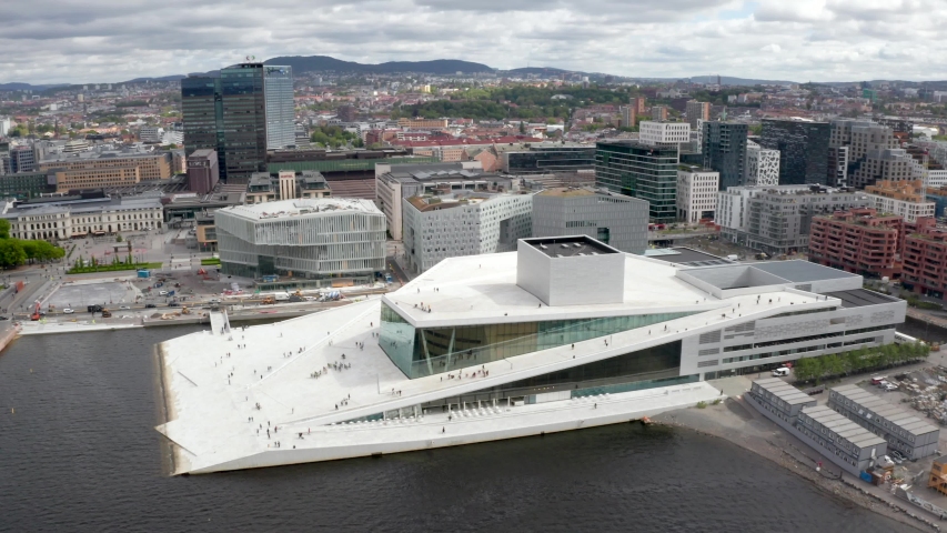 Aerial view on the National Oslo Opera House and Oslo downtown against cloudy sky