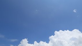 Beautiful weather background of Cumulus or cumulonimbus cloud formation building motion at right side of TimeLapse video clip on tropical summer blue sky in morning sunlight, puffy & fluffy cloudy sky